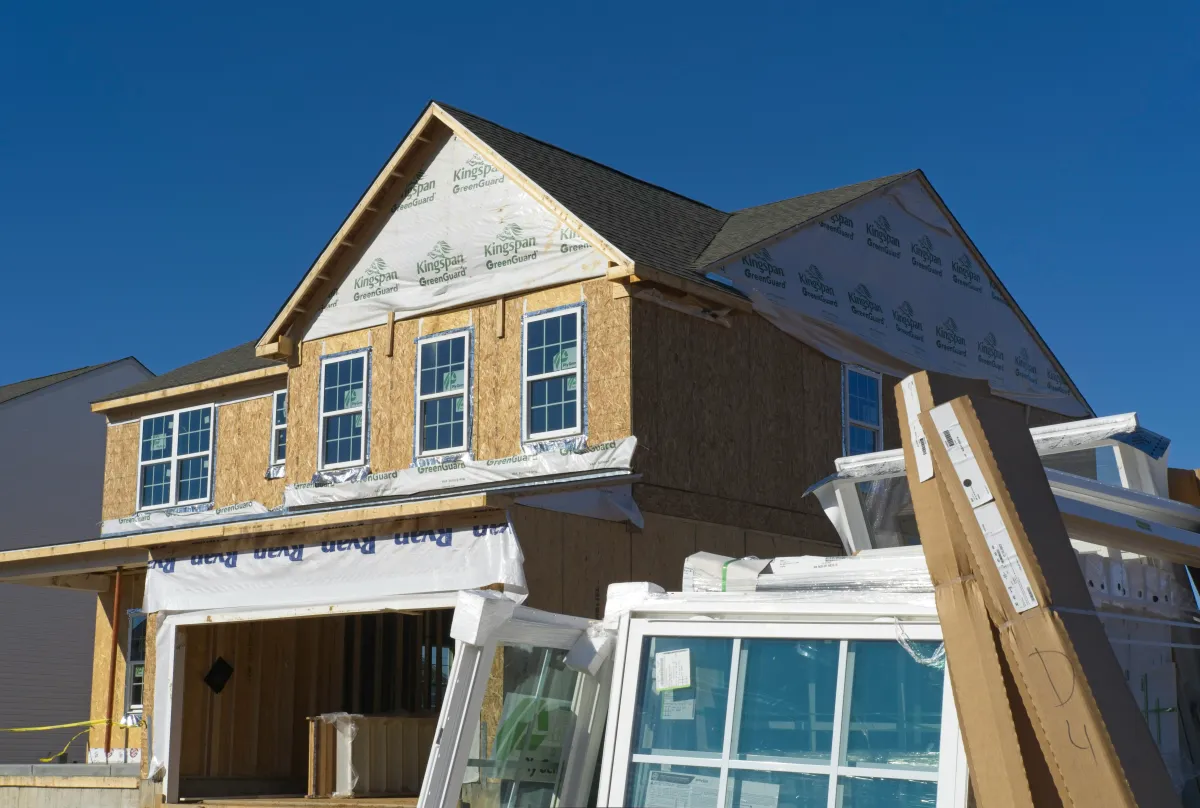 New home under construction with framing and sheathing