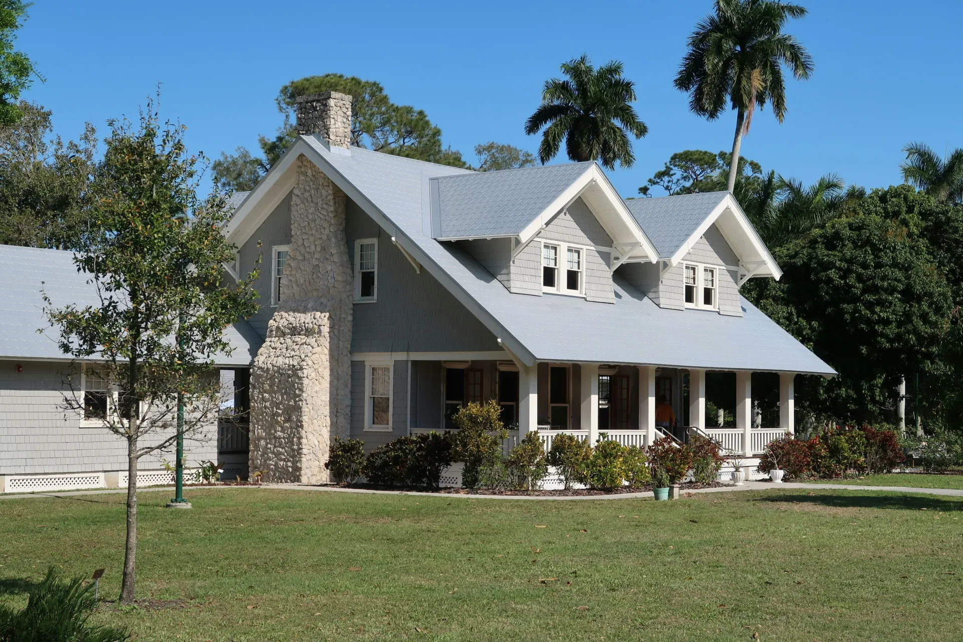 Craftsman-style home with stone chimney